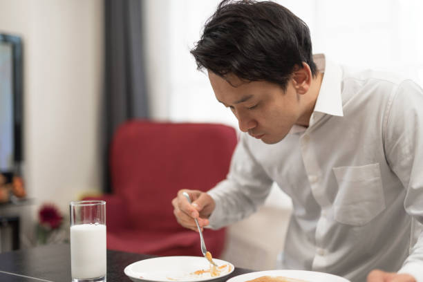 istock businessman eating breakfast in his house 960861514
