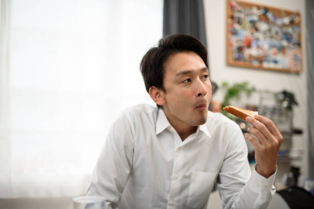 istock businessman eating breakfast in his house 960861582