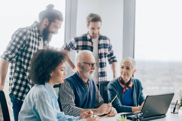 istock Coworkers of all ages at office 960865740