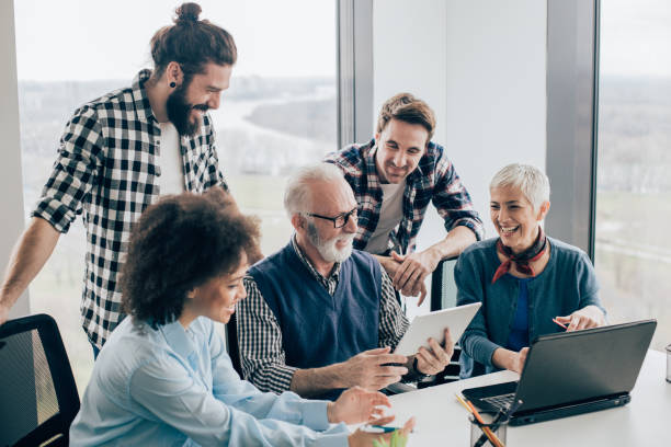 istock Coworkers looking at digital tablet 960865844