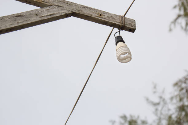 istock The bulb burns on a wooden pole 960868260