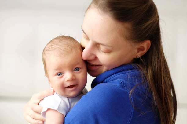 istock One month old newborn baby with mother 960872192