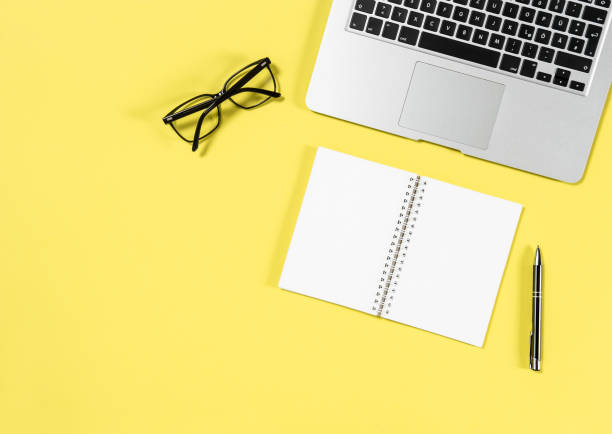 istock Office workplace minimal flat lay Laptop notebook glasses 960872558