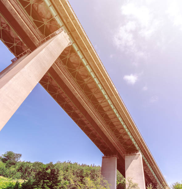 istock highway bridge with supports, straight autostrada, bottom view 960881986