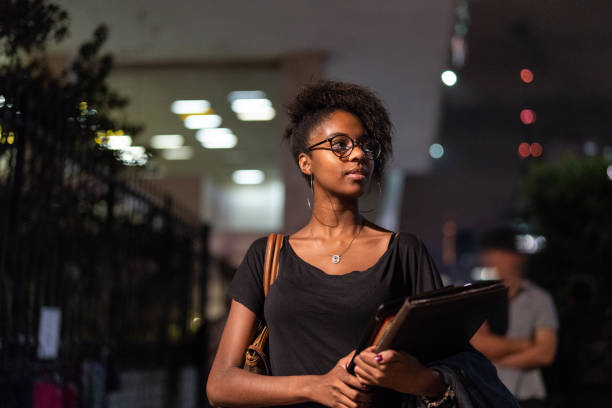 Student University Walking in the Street at Night Brazilian woman in the street brazilian culture stock pictures, royalty-free photos & images