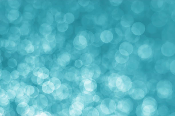 istock abstract aqua blue bokeh glitter sparkle background. 960894516