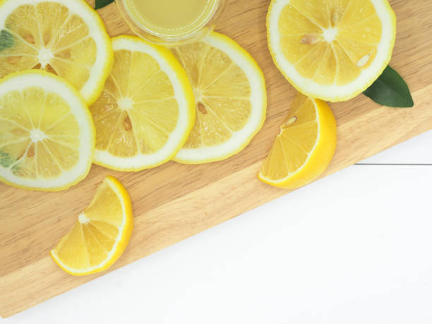 istock Fresh lemon slice with lemonade on white wood background 960902104