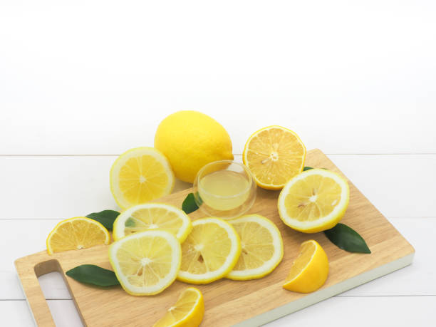 istock Fresh lemon slice with lemonade on white wood background 960906042