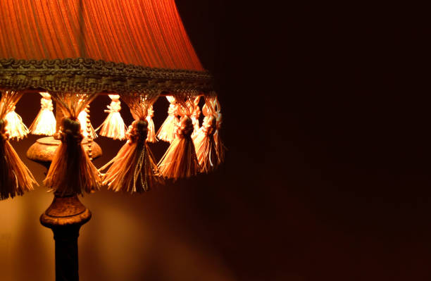 istock Closeup fabric lamp on bedside table interior room. Space for writing text. 960915672