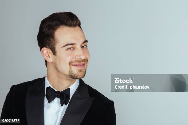Young Handsome Man In A Tuxedo Looking At The Camera Stock Photo - Download Image Now