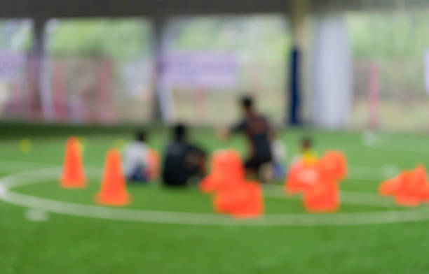 istock Soccer training equipments on training ground with children 960916374