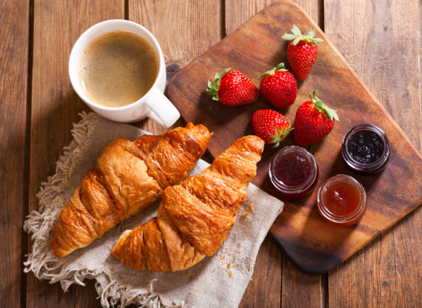 istock breakfast with croissants and coffee, top view 960924038