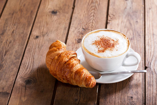 istock Cup of cappuccino coffee with croissant 960924160