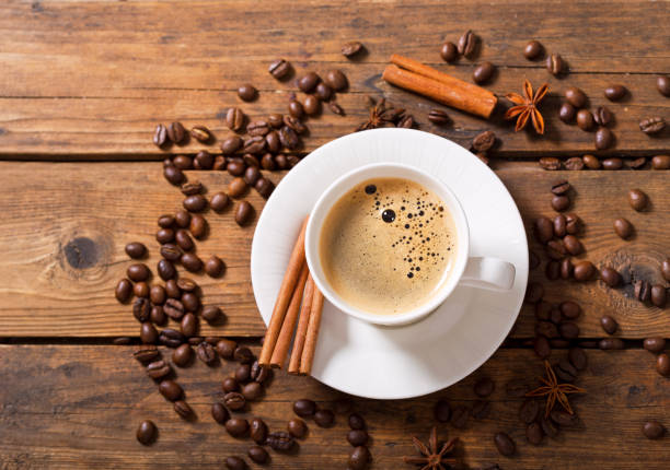 istock cup of coffee with coffee beans, top view 960926208