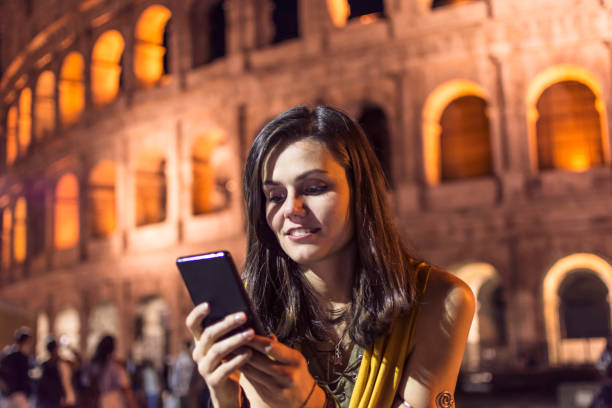 istock Smiling girl with phone 960926418
