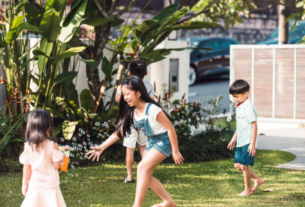 istock Four children playing on the backyard 960926472