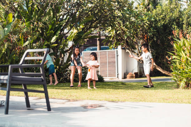 istock Four children playing on the backyard 960926482