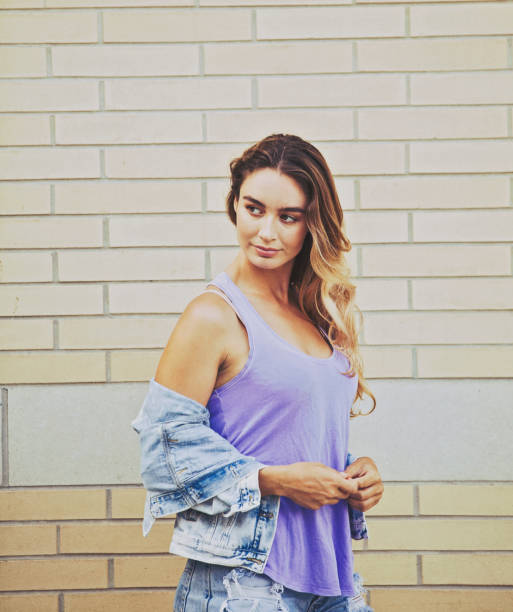 istock Woman Portrait by a Brick Wall 960927512