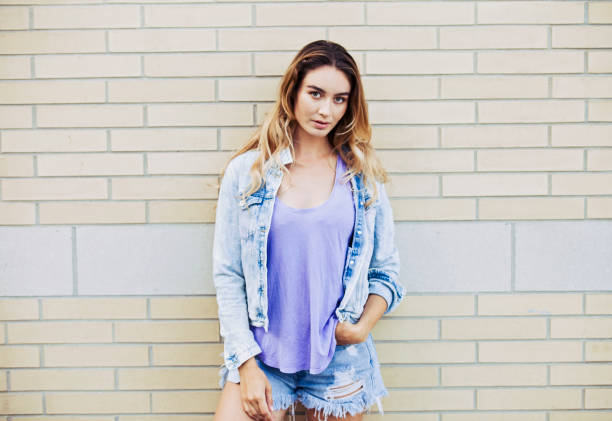 istock Woman Portrait by a Brick Wall 960927516