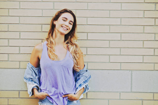 istock Woman Portrait by a Brick Wall 960927546