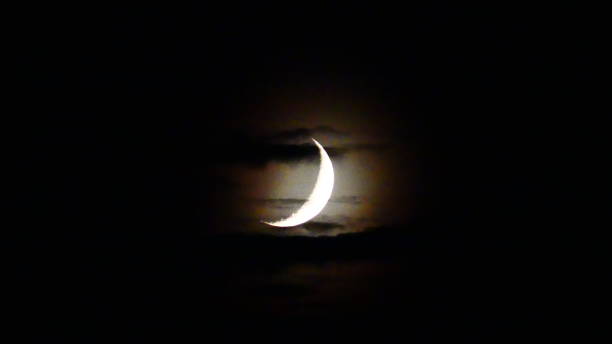 istock Half moon that illuminates the clouds in the night 960930904