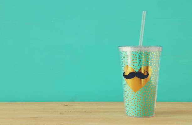 istock Image of plastic cup with golden heart. Father's day concept. 960931848