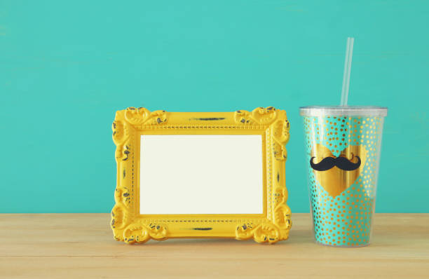 istock Image of plastic cup with golden heart. Father's day concept. 960931922