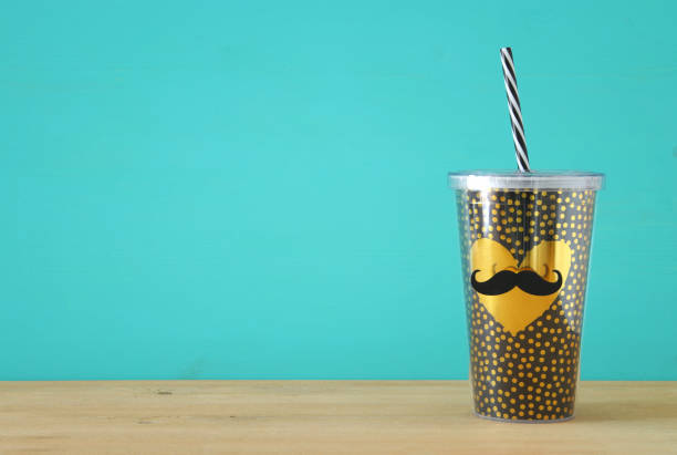 istock Image of plastic cup with golden heart. Father's day concept. 960931940
