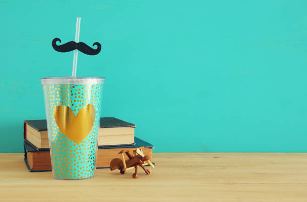 istock Image of plastic cup with golden heart. Father's day concept. 960931948