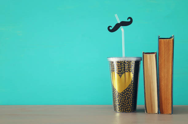 istock Image of plastic cup with golden heart. Father's day concept. 960933548