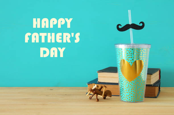 istock Image of plastic cup with golden heart. Father's day concept. 960933902