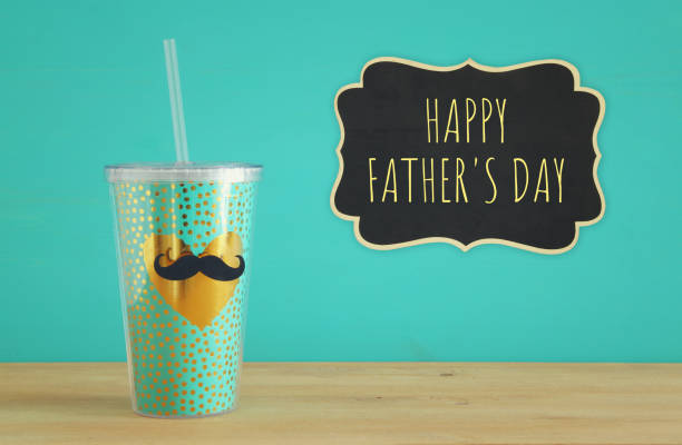 istock Image of plastic cup with golden heart. Father's day concept. 960933968