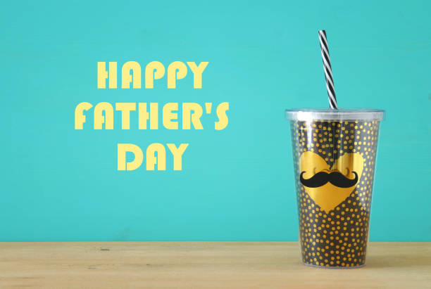 istock Image of plastic cup with golden heart. Father's day concept. 960933976