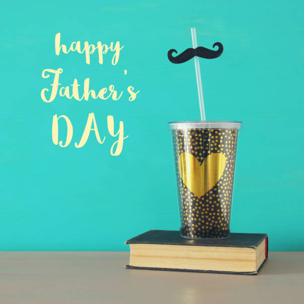 istock Image of plastic cup with golden heart. Father's day concept. 960933994