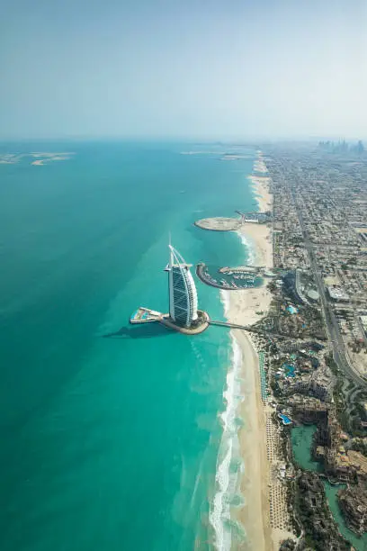 Aerial view of Dubai city beach and coast line on a clear sunny day.