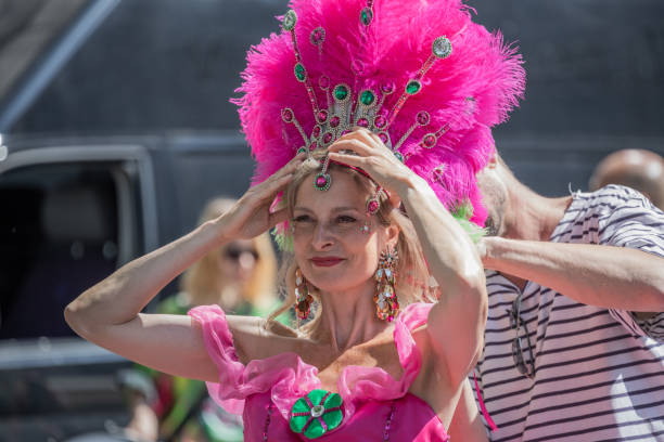 Young woman getting ready for the Copenhagen Whitsun Carnival, 2018 Young woman getting ready for the Copenhagen Whitsun Carnival, 2018 on a beautiful warm spring Sunday in May whitsun stock pictures, royalty-free photos & images