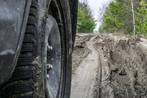 istock Car on swamp dirt road. Off road trip 960949862
