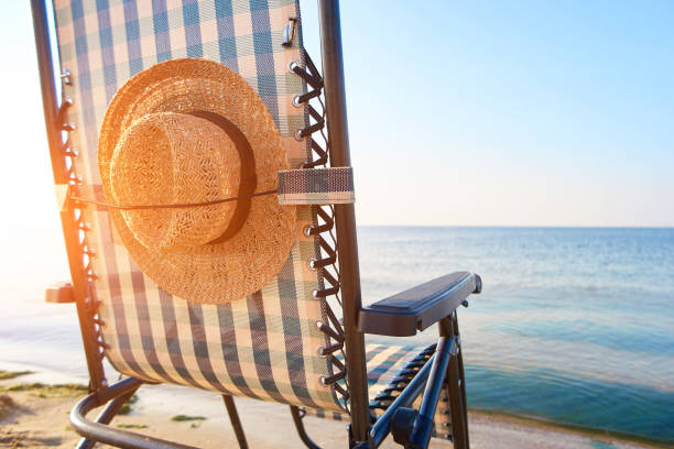 3d rendering of beach chair and umbrella. Summer, travel destinations concept.