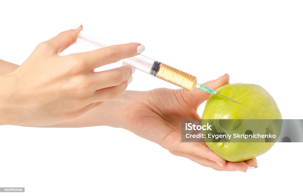 Spritze in den Händen eines Apfels - Lizenzfrei Apfel Stock-Foto