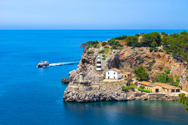 istock Lighthouse at Port de Soller on Majorca island, Spain Mediterranean Sea 960951452