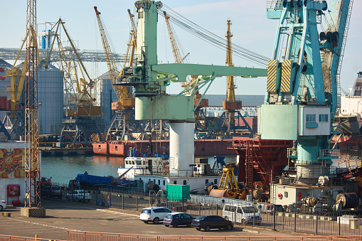 Sea port metal structures for transportation. Industrial city with sea port.