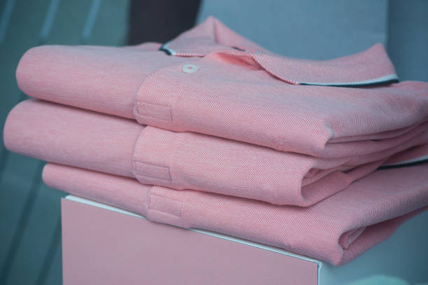 istock pink polos stack in a men fashion store 960960266