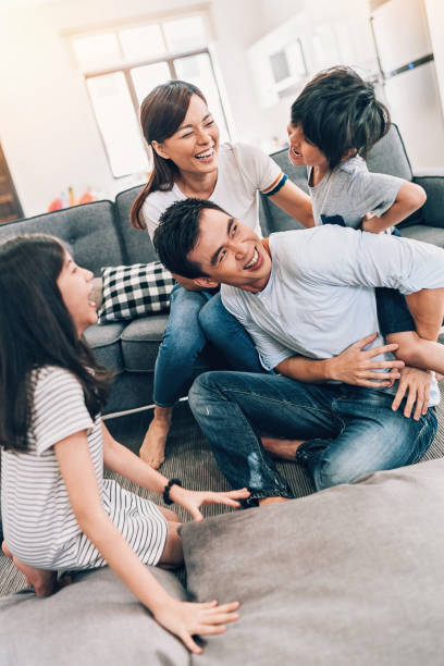 istock Playful family at home 960963948