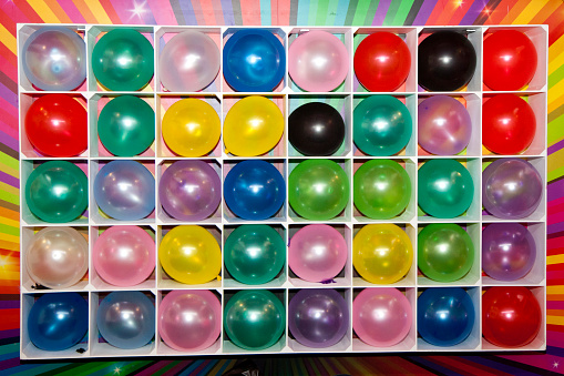 Wall of Colorful Balloons at Carnival