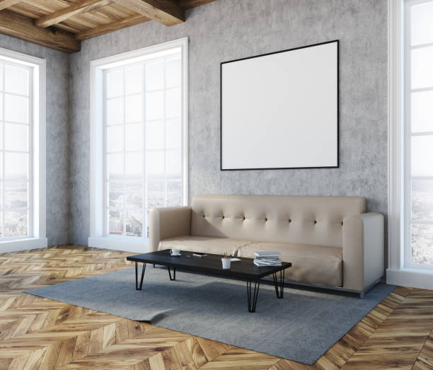 istock Concrete living room corner, beige sofa, poster 960964272
