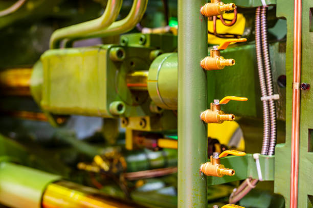 Fragment of the injection molding machine. Abstract industrial background.