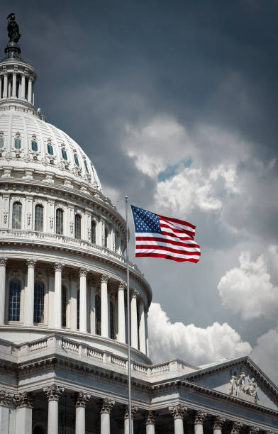 istock US Capitol and waving american flag 960986132