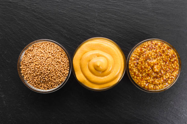 istock Set of different species of mustard on a rustic background 960986162