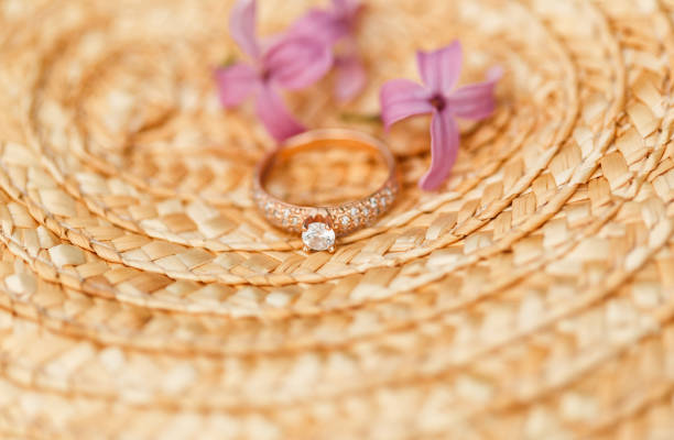 jewelry engagement ring with diamonds and spring lilac flowers