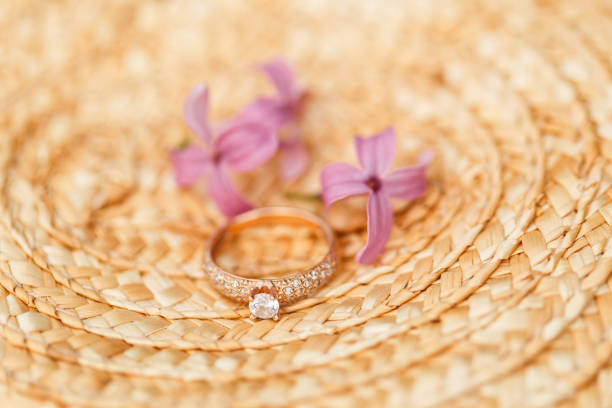 istock jewelry engagement ring with diamonds and spring lilac flowers 960986394